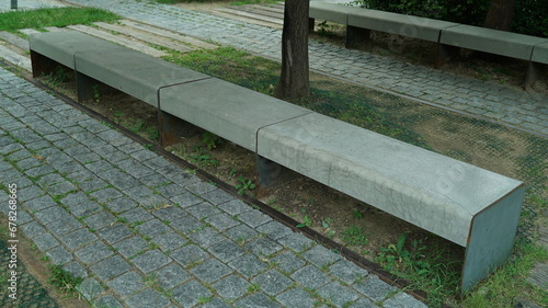 Long rows of benches in an outdoor park photo