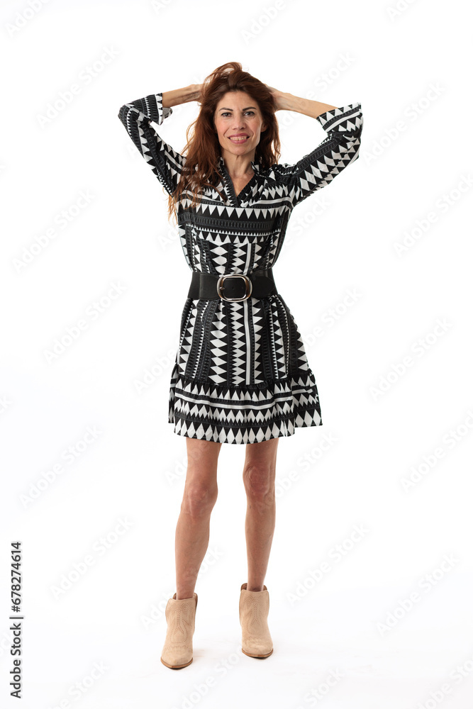 very thin model over 50 with short dress on white background very thin model over 50 with short dress on white background