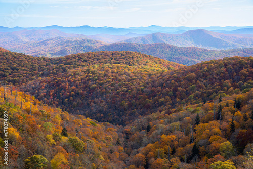 High angle view of vibrant autumn colors in the Blue Ridge Mountains of North Carolina, USA. © Wollwerth Imagery