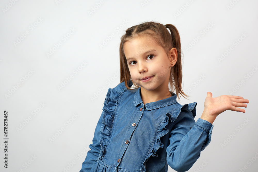 Portrait of beautiful girl raising hand aside show something Portrait of beautiful girl raising hand aside show something