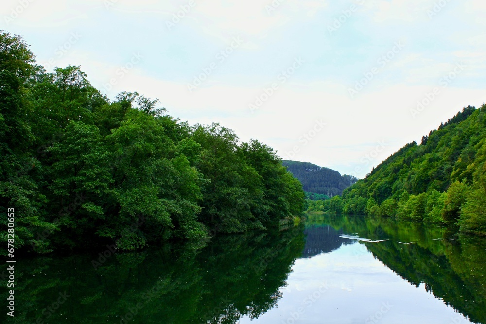 Natural view of a calm river and forest landscape in Germany