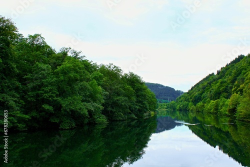 Natural view of a calm river and forest landscape in Germany