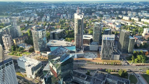 Green capital Vilnius of Lithuania. Urbanistic. Modern area. Day Aerial video of downtown Vilnius in Lithuania on a sunny day. New skyscraper district, financial buildings
