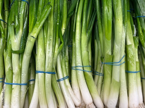 vegetables in the store, young onions on the counter