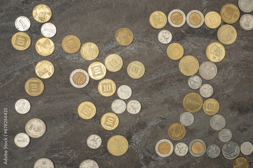 Israel's new shekel (NIS) coins in heap. Israel currency Money cash coins of various denominations and Concept financial diversity of numismatics. value of different coin nominations. Israel's new shekel (NIS) coins in heap. Israel currency Money cash coins of various denominations and Concept financial diversity of numismatics. value of different coin nominations.