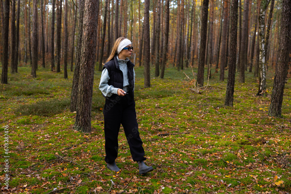 girl in the wood looking for a mushrooms girl in the wood looking for a mushrooms