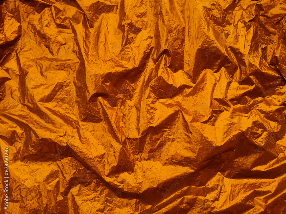 Brown texture of wrinkled plastic or crumpled plastic of reflecting. Grungy copy space