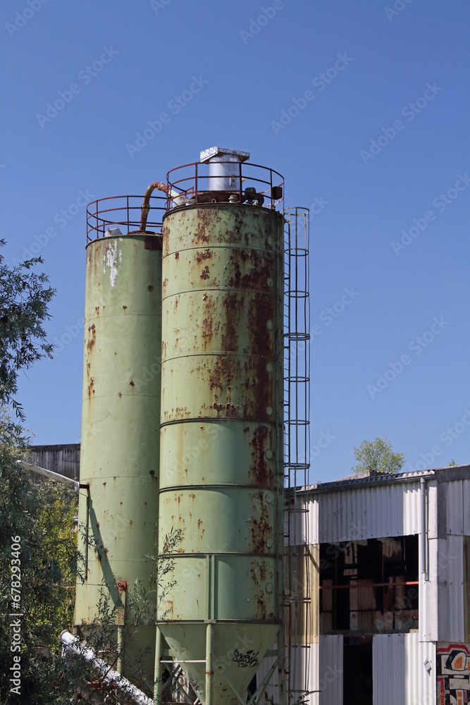 Two raw material silos on an abandoned factory site in Speyer