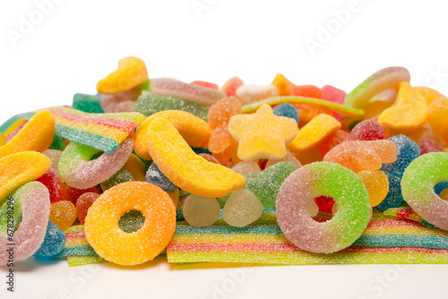 Assorted gummy candies isolated on a white background. Top view.