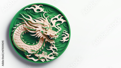 A minimal, paper cut style green dragon in circle as a symbol of the Chinese New Year, isolated on a light gray background. Happy holiday concept. Copy space. Banner © Garnar