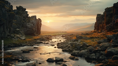  a river running through a lush green field next to a rocky cliff face covered in grass and a sun setting in the distance over the mountains behind the rocks and a valley.