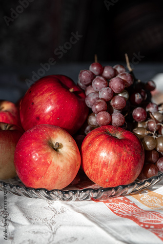 autumn still life. apples and grapes. fruits in a plate. red apple. food. fruits. autumn. 