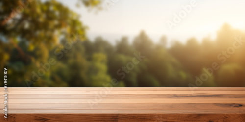 Empty wooden table over blurred nature background, for product display montage