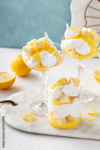 Lemon parfait or eton mess with lemon curd, meringue kisses and pound cake