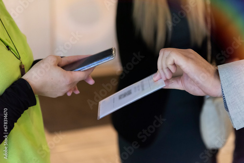 Event QR code ticket scanning. Businessman registering for a business conference using his smart phone
