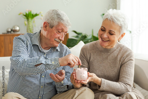 Saving money investment for future. Senior adult mature couple holding piggy bank putting money coin. Old man woman counting saving money planning retirement budget. Saving investment banking concept