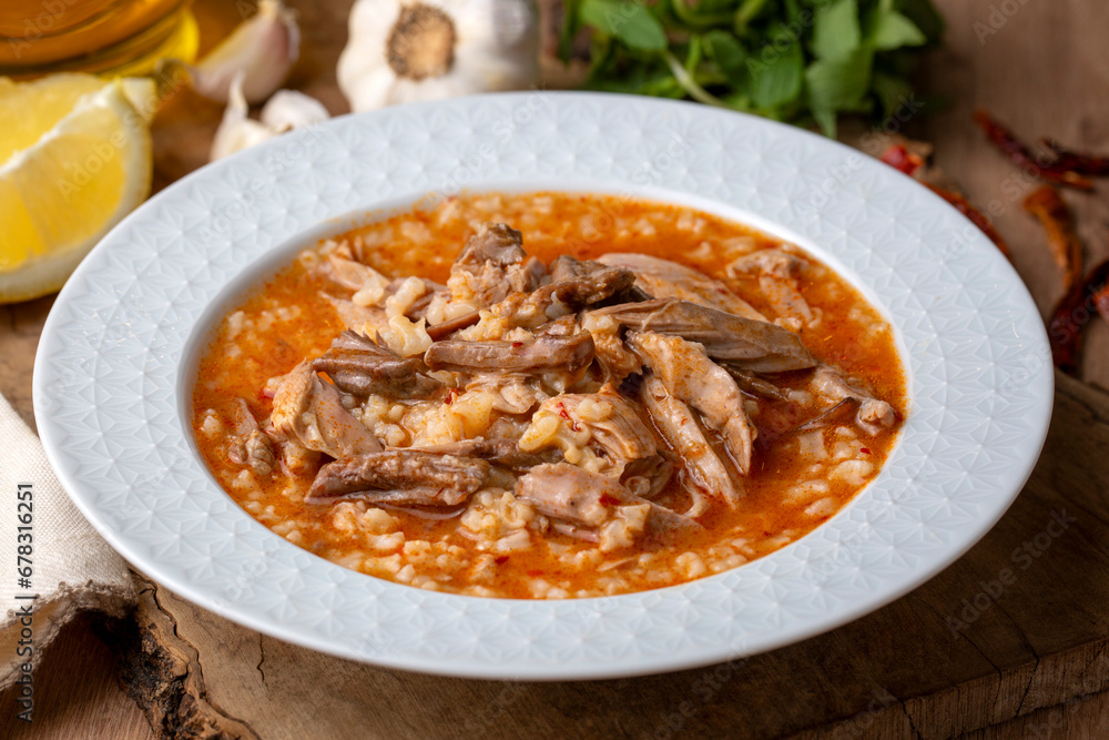 Turkish Soup Beyran with Lamb Meat, Rice, Chopped Garlic and Vinegar Sauce. Traditional Organic Food. Traditional soup of Gaziantep, Turkey. (Turkish name; Beyran corbasi) Turkish Soup Beyran with Lamb Meat, Rice, Chopped Garlic and Vinegar Sauce. Traditional Organic Food. Traditional soup of Gaziantep, Turkey. (Turkish name; Beyran corbasi)