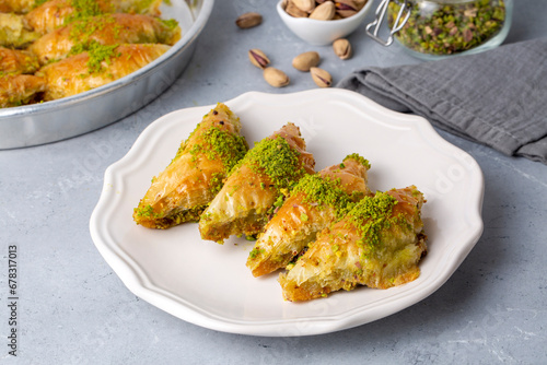 Turkish Dessert Sobiyet Baklava. Turkish pistachio baklava on a white background. Local name şöbiyet baklava