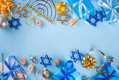 Happy Hanukkah greeting card background. Jewish New Year holiday flat lay with traditional symbols of hanukkah festival, menorah, donuts and decorations copy space photo