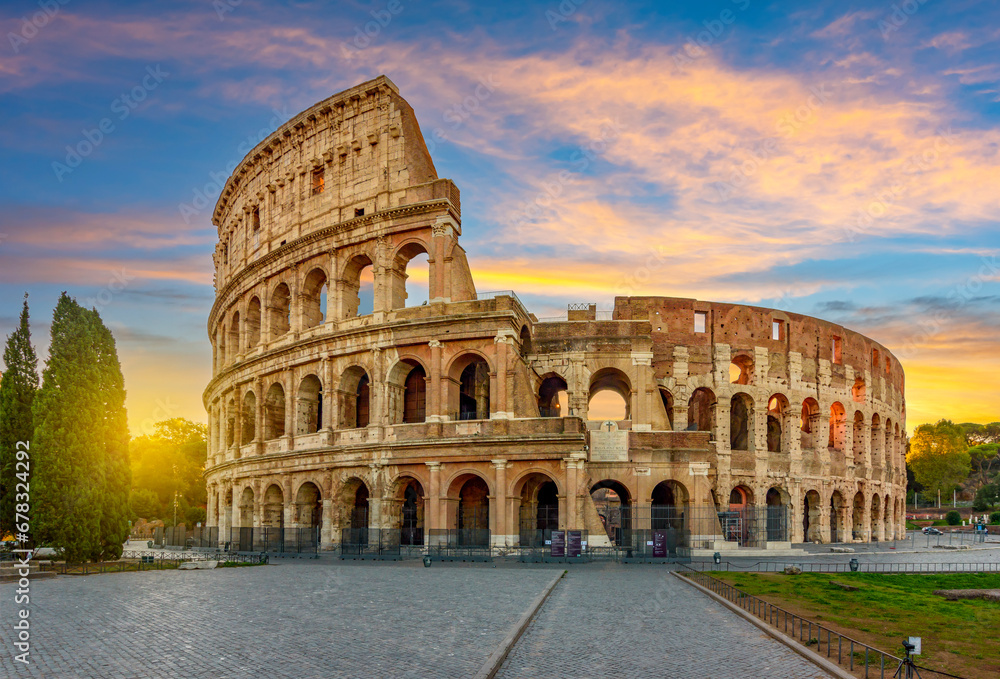Ancient Colosseum (Coliseum) building at sunrise, Rome, Italy