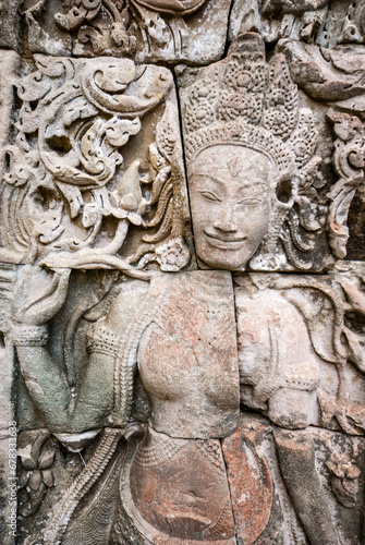 Female sculpture on the facade of Angkor Thom Bayon, Angkor. Cambodia, Asia © jeeweevh