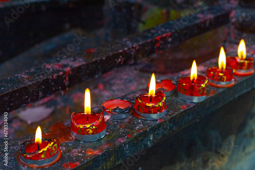 Chinese bddhist prayind candles in Zi Shi park in Zhuji, China photo