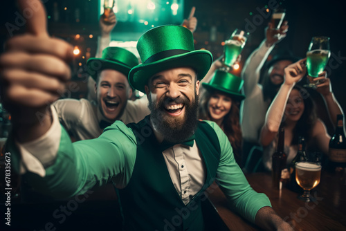 Young people are having fun, wearing green costumes and celebrating St. Patrick's Day in a bar