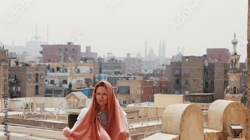 Woman tourist in Bab Zuweila historical landmark in Cairo Egypt 