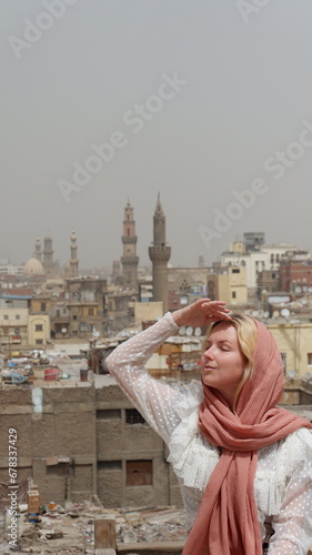 Woman tourist in Bab Zuweila historical landmark in Cairo Egypt  photo