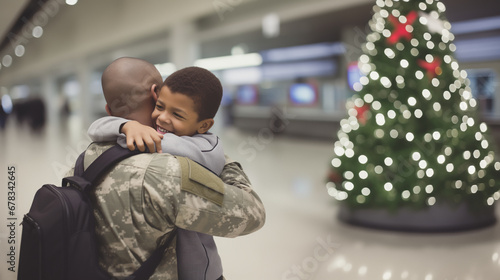 A military African American father reunites with his son at the airport, embracing emotionally after an armed conflict, returning home for Christmas.Christmas tree in the background,copy space photo
