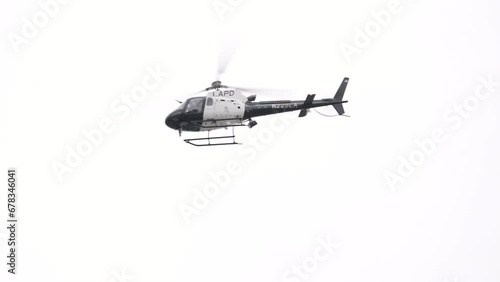 911 Police chopper searching for suspect in the daylight in Los Angeles, California, USA