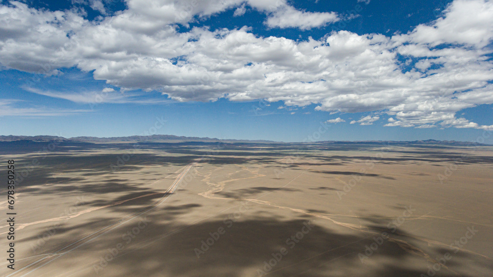 Expansive Mongolian desert with a dynamic sky aerial