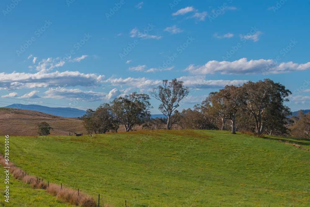 Road trippin through the dry countryside under a blue sky with clouds Road trippin through the dry countryside under a blue sky with clouds
