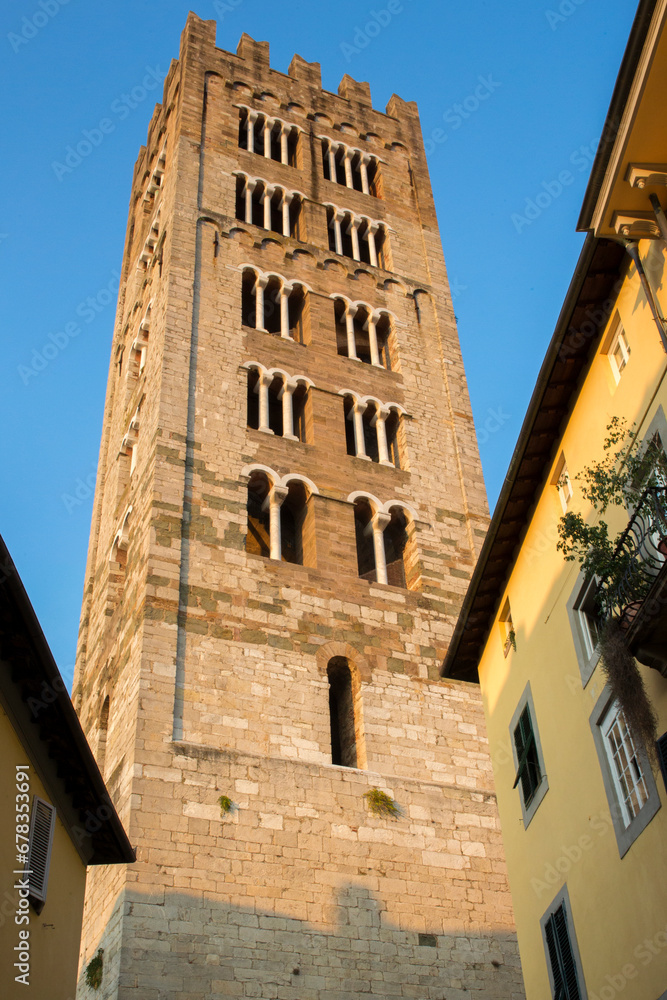 Bell tower of the Basilica of San Frediano in Lucca, Tuscany, Italy. It is entirely built in stone.