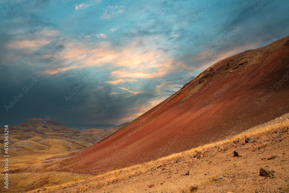 Naklejka premium Dramatic sunset in the volcanic mountains.