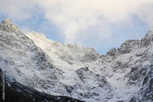 Winter Carpathian mountains in Poland Zakopane. Awesome mountain landscape, mountaineer silhouette.