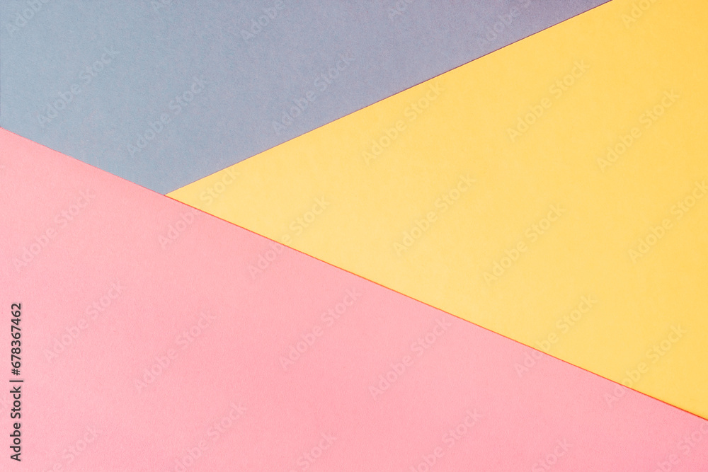 Yellow, pink and purple colored paper. Geometric empty paper background of three tones for copy space Yellow, pink and purple colored paper. Geometric empty paper background of three tones for copy space