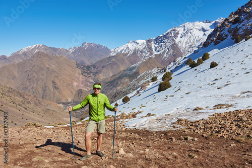 A tourist stands on the Atlas Mountains pass