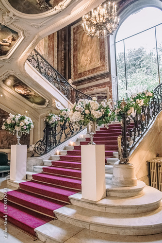 staircase in the castle with a red carpet for a wedding