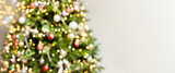 Defocus blurred background with elegant fir, garlands, highlights. Beautiful festive Christmas tree, New Year's Eve and Christmas. Festive postcard, concept of the holiday