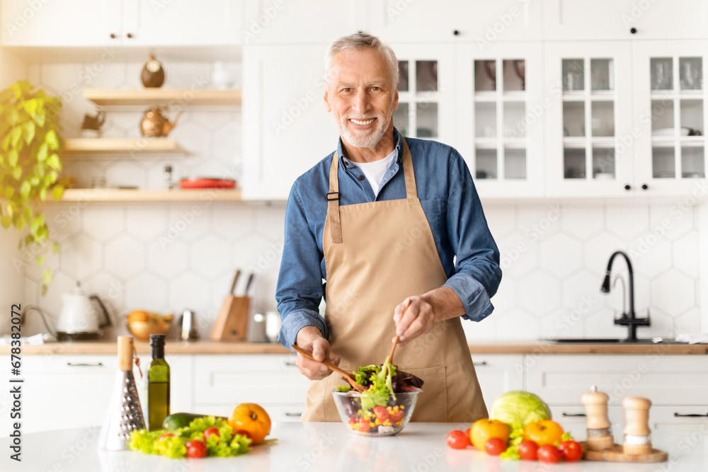 Cooking Concept. Portrait Of Happy Senior Man Preparing Vegetable Salad In Kitchen Cooking Concept. Portrait Of Happy Senior Man Preparing Vegetable Salad In Kitchen