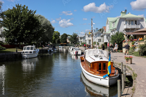 Fotografie View of the Trosa river with moored pleasure boats  in the picturesque seaside town of Trosa in Södermanland