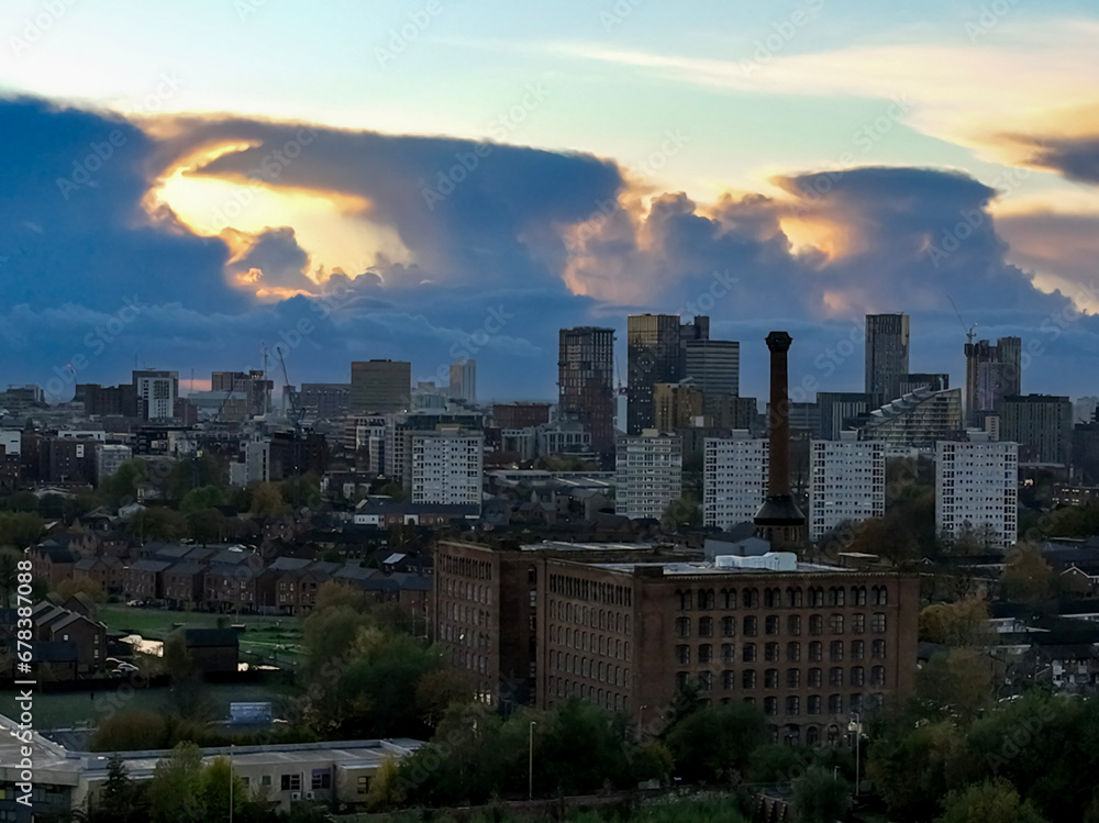 Victorian Mill and Manchester Skyline during twilight hour 
