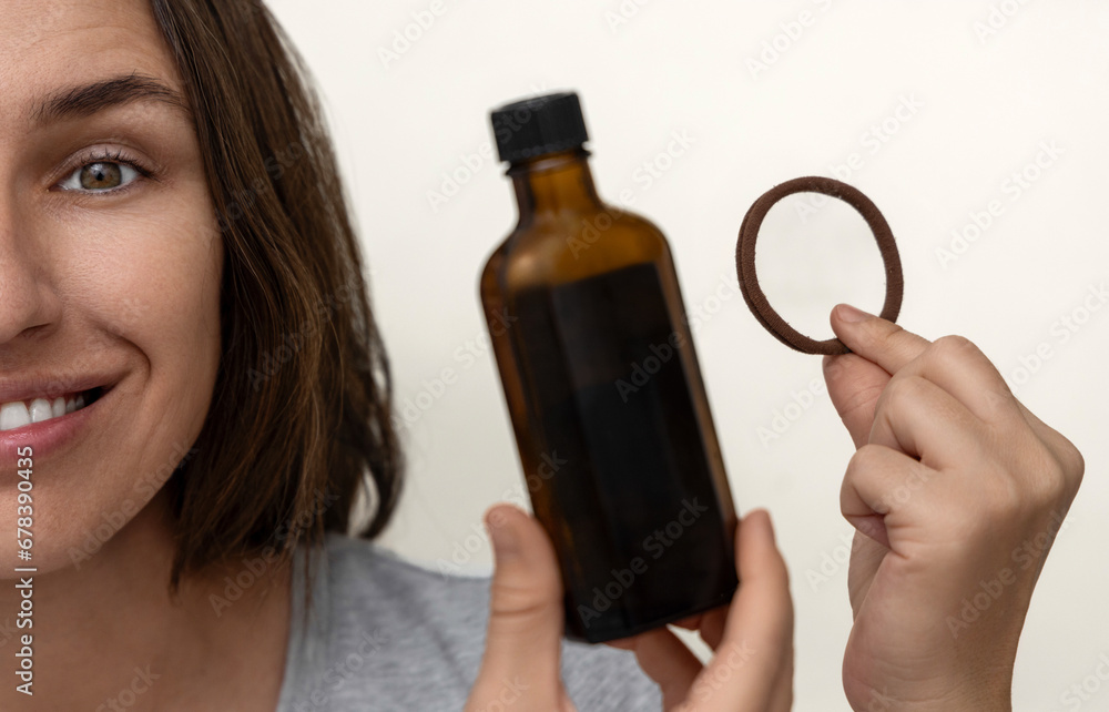 happy millennial woman showing healthy hair,holding elastic and oil treatment,many plastic blisters.girl brushing with eco wooden comb,doctor hand in surgical glove.brown dark bottle with serum happy millennial woman showing healthy hair,holding elastic and oil treatment,many plastic blisters.girl brushing with eco wooden comb,doctor hand in surgical glove.brown dark bottle with serum