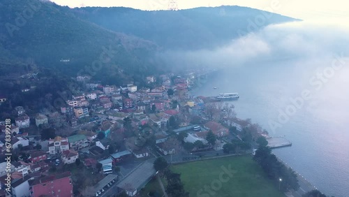 Istanbul, Anadolu Kavağı resort town in dense fog. A mist bank covered the whole Bosphorus like a cotton quilt. Aerial drone view
 photo