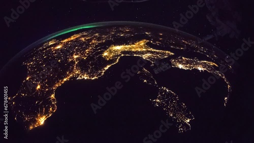 Cities illumination at night seen from space. Flying over Planet Earth. View from International Space Station. Public Domain images from Nasa	
 photo