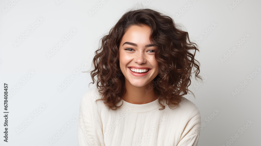 Portrait of a young and beautiful brunette woman on white background, smiles and laughs to the camera. Advertising concept.
Portrait of a young and beautiful brunette woman on white background, smiles and laughs to the camera. Advertising concept.