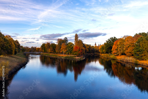 Nice view of the river and beautifully colored trees on the shore © Martin