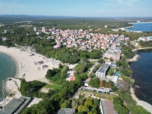 Aerial shot of the coastal town of Primorsko with a public beach and residential houses photo