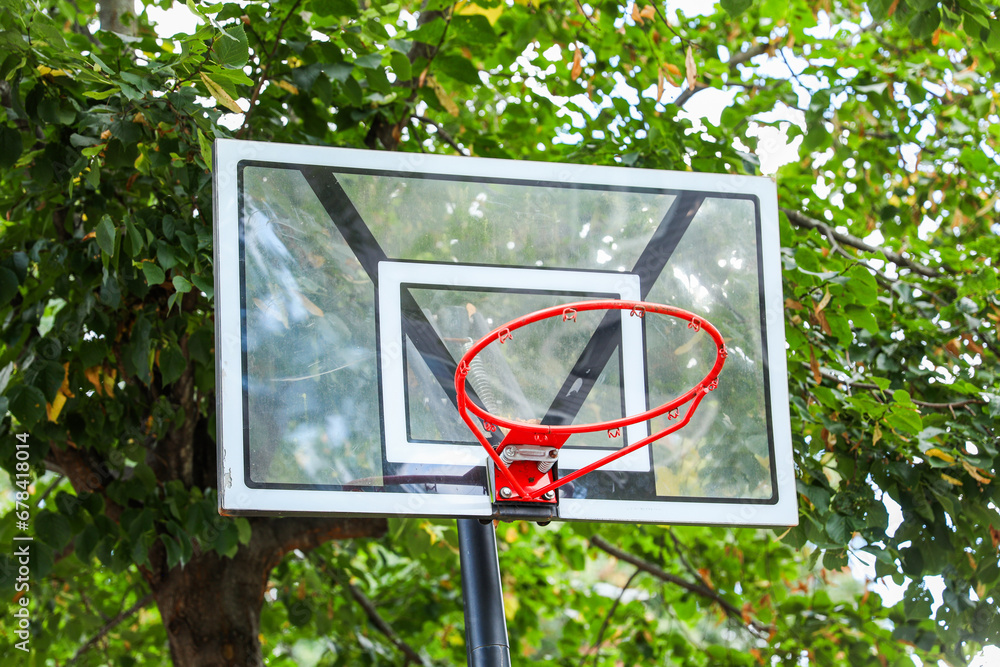 basketball hoop stands tall against a sunset sky, inviting play and